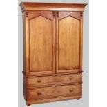 A 19TH CENTURY CONTINENTAL DEAL PRESS CUPBOARD, the out-swept pediment above two rectangular