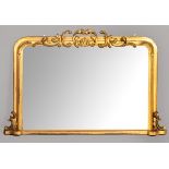 A VICTORIAN GILT FRAMED OVERMANTEL MIRROR, set within a moulded frame with rococo decorative