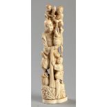 A LATE 19TH CENTURY JAPANESE IVORY FIGURE OF A FISHERMAN AND HIS THREE SONS, complete with basket of