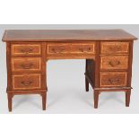 AN EDWARDIAN MAHOGANY WRITING DESK, the moulded rectangular top above on long central drawer and