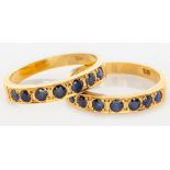 A PAIR OF 18CT YELLOW GOLD AND SAPPHIRE HALF ETERNITY RINGS, claw-set with seven sapphires each,