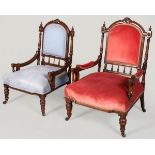 A NEAR PAIR OF LATE VICTORIAN MAHOGANY ARMCHAIRS, the backs with carved top-rails, padded rests