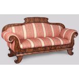 A 19TH CENTURY CONTINENTAL FLAME MAHOGANY SOFA, the upholstered back, seats and armrests within a