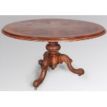 A VICTORIAN WALNUT AND BURR WALNUT OVAL TABLE, the quarter-veneered and coss-banded top with a
