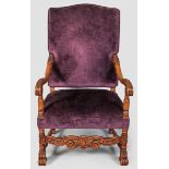 A 20TH CENTURY OAK HIGH-BACK ARMCHAIR, covered in purple velvet and needlework, the heavy