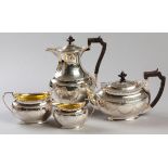 AN EDWARDIAN FOUR PIECE SILVER TEA AND COFFEE SERVICE, SHEFFIELD 1910, H.A., comprising: of a