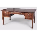 A 20TH CENTURY TEAK WRITING DESK, the rectangular top above a single longg drawer and four short