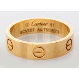 AN 18CT YELLOW GOLD CARTIER "LOVE" RING, ring stamped "Cartier", serial number BVC107, 6.7g, in