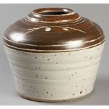 HYME RABINOWTIZ (SOUTH AFRICAN: 1920 - 2009), a brown and cream glazed stoneware jar, with