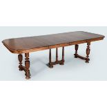 A LATE 19TH CENTURY ENGLISH OAK EXTENDING DINING TABLE, the moulded top including two leaves above a