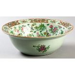 A MID-19TH CENTURY CHINESE FAMILLE ROSE BOWL, Circa 1850, decorated with birds and flowers with a
