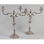 A PAIR OF SILVERPLATE CANDELABRA, the removable twin branches with floral-form finials, the stem