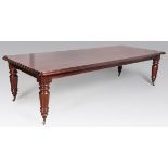 A VICTORIAN-STYLE MAHOGANY DINING TABLE, the well-figured top above a double moulding, a beaded