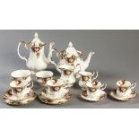 A ROYAL ALBERT "CELEBRATION" PATTERN TEA AND COFFEE SERVICE, comprising: of a teapot, coffee pot,