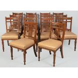 A SET OF FOURTEEN EDWARDIAN OAK AND MAHOGANY DINING CHAIRS, the backs with scratch-beaded top-