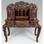 A CARVED CHINESE HARDWOOD ESCRETOIRE, the upper-section with pierced high relief carving