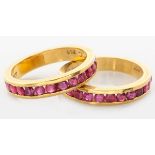 A PAIR OF 18CT YELLOW GOLD AND RUBY HALF ETERNITY RINGS, channel-set with twelve rubies each, rubies