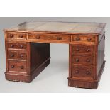 A VICTORIAN MAHOGANY PEDESTAL WRITING DESK, the gilt tooled leather inlaid top with a moulded edge
