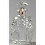 A GLASS AND SILVERPLATE TANTALUS DECANTER, the removable stopper fitted with locking mechanism,