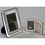 A STERLING SILVER PHOTOGRAPH FRAME, with beatenwork frame, velvet lined backing, 22.5cm by 17.5cm.