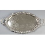 A SILVERPLATE OVAL TWIN-HANDLE TRAY, the applied handles embossed with shells and swags, the applied