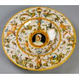 A 19th CENTURY CONTINENTAL MAJOLICA CHARGER, the border painted with figures of nudes and mythical