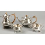 A FOUR PIECE SILVER TEA AND COFFEE SET, BIRMINGHAM 1947 & 1948, P.P. LTD., comprising a teapot,