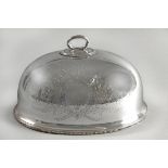 A SILVERPLATE MEAT DOME. With removable handle, the body engraved with flowers and leaves on a