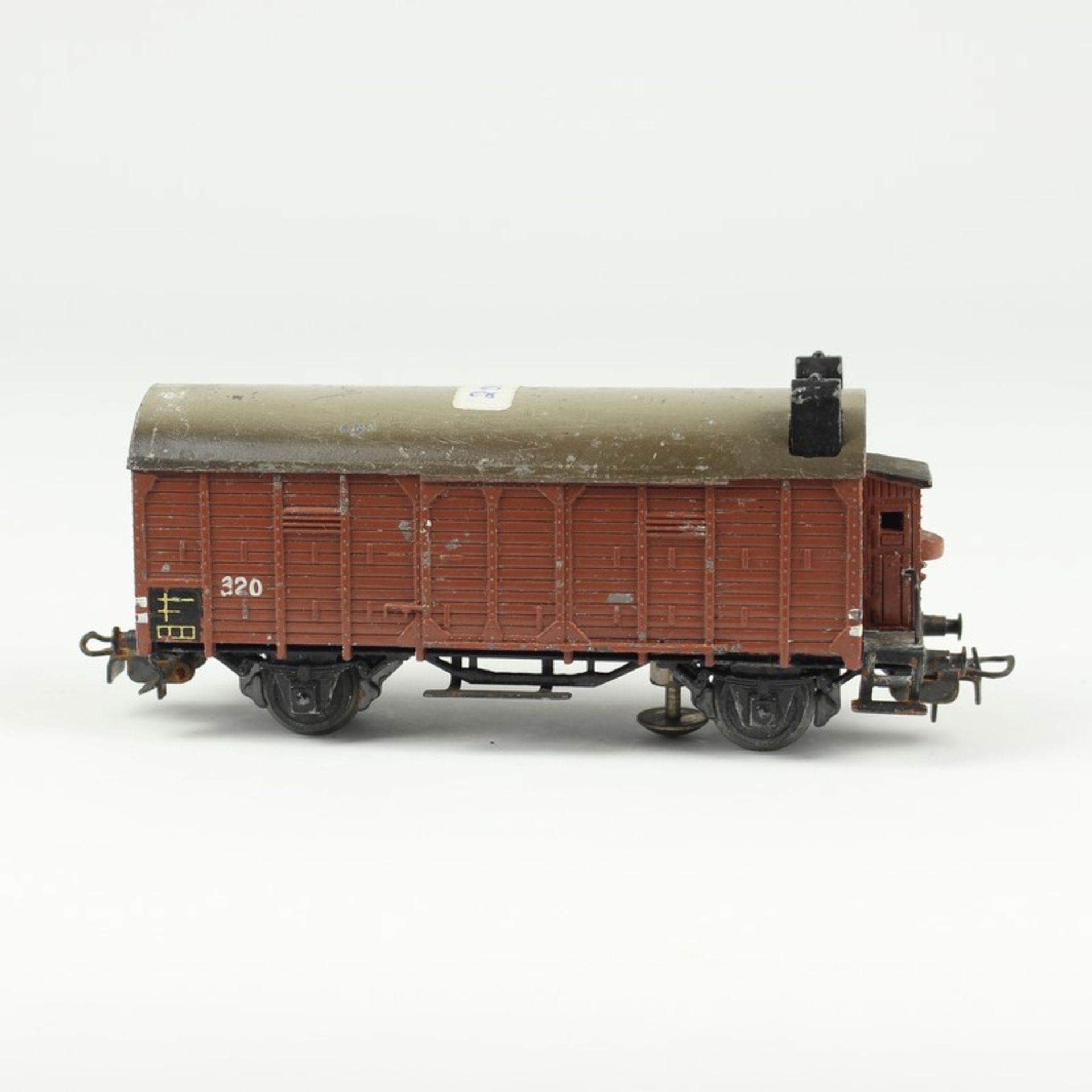 Märklin - Eisenbahnum 1952/53, HO, geschlossener Güterwagen 320S mit Bremserhaus u. Rücklichtern auf