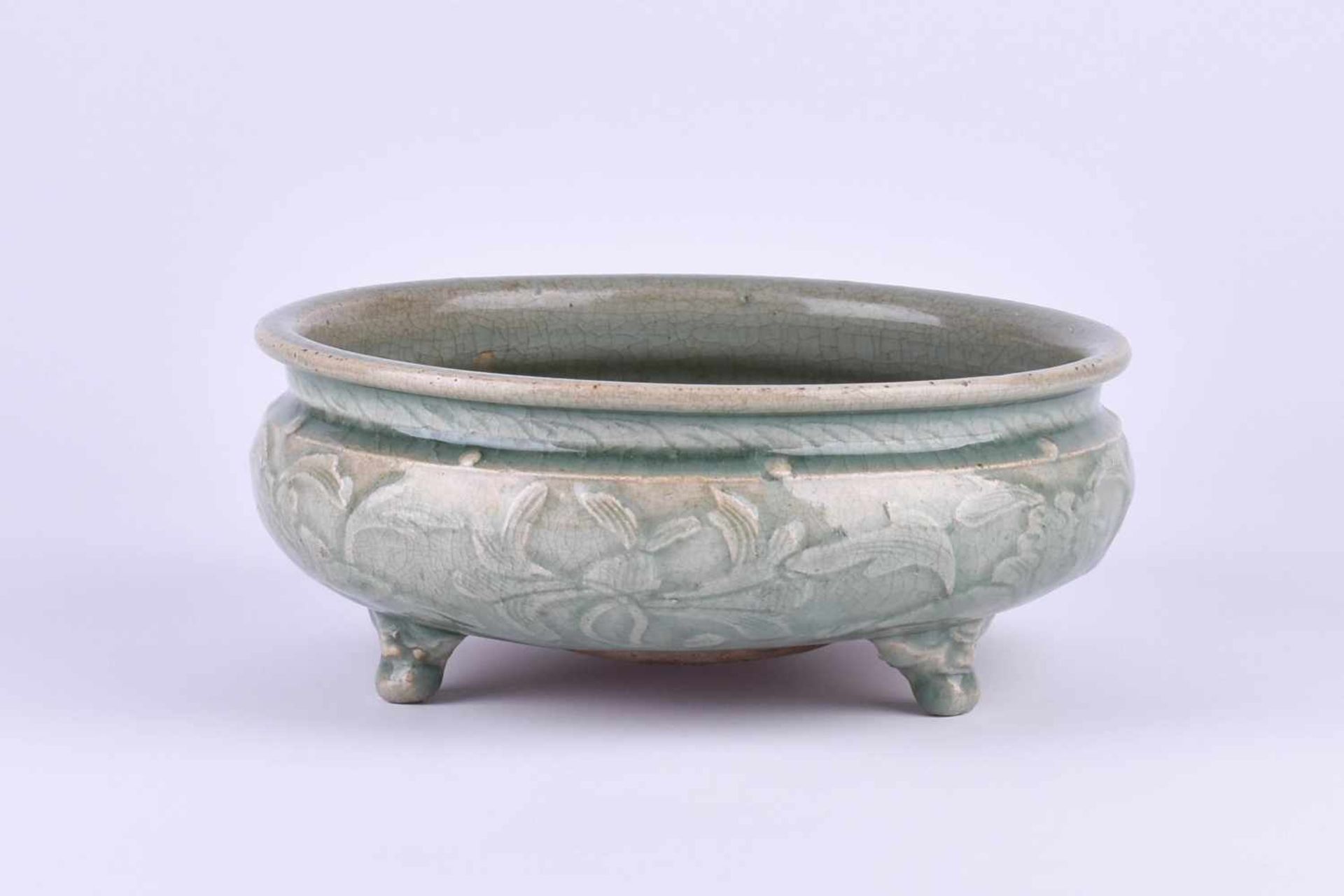 Celadon bowl China Ming periodceladon glaze, all around decorated with reliefed floral decoration, - Image 2 of 5