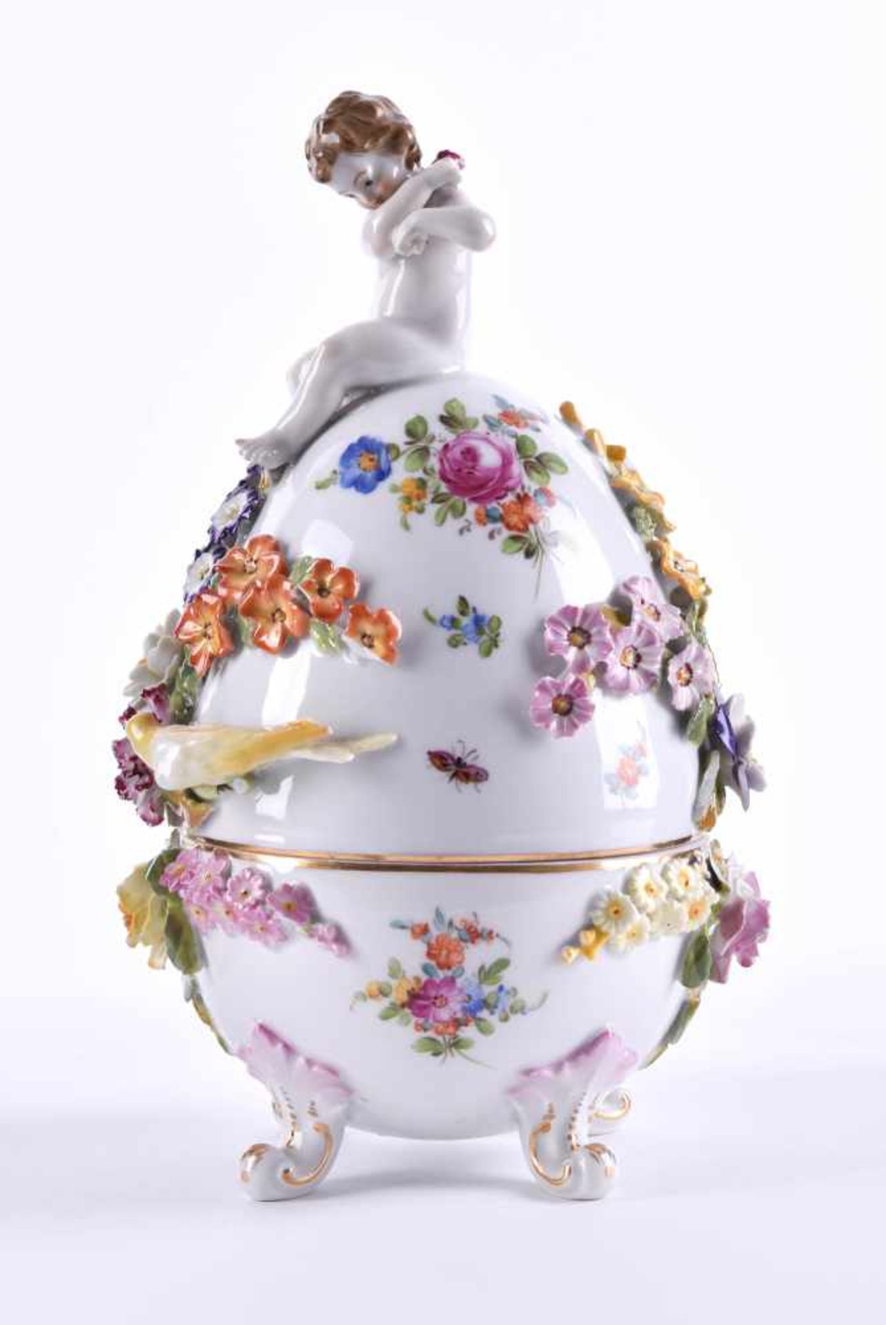 Porcelain egg Pottschappel Dresdencolorfully painted, all around decorated with full plastic flowers