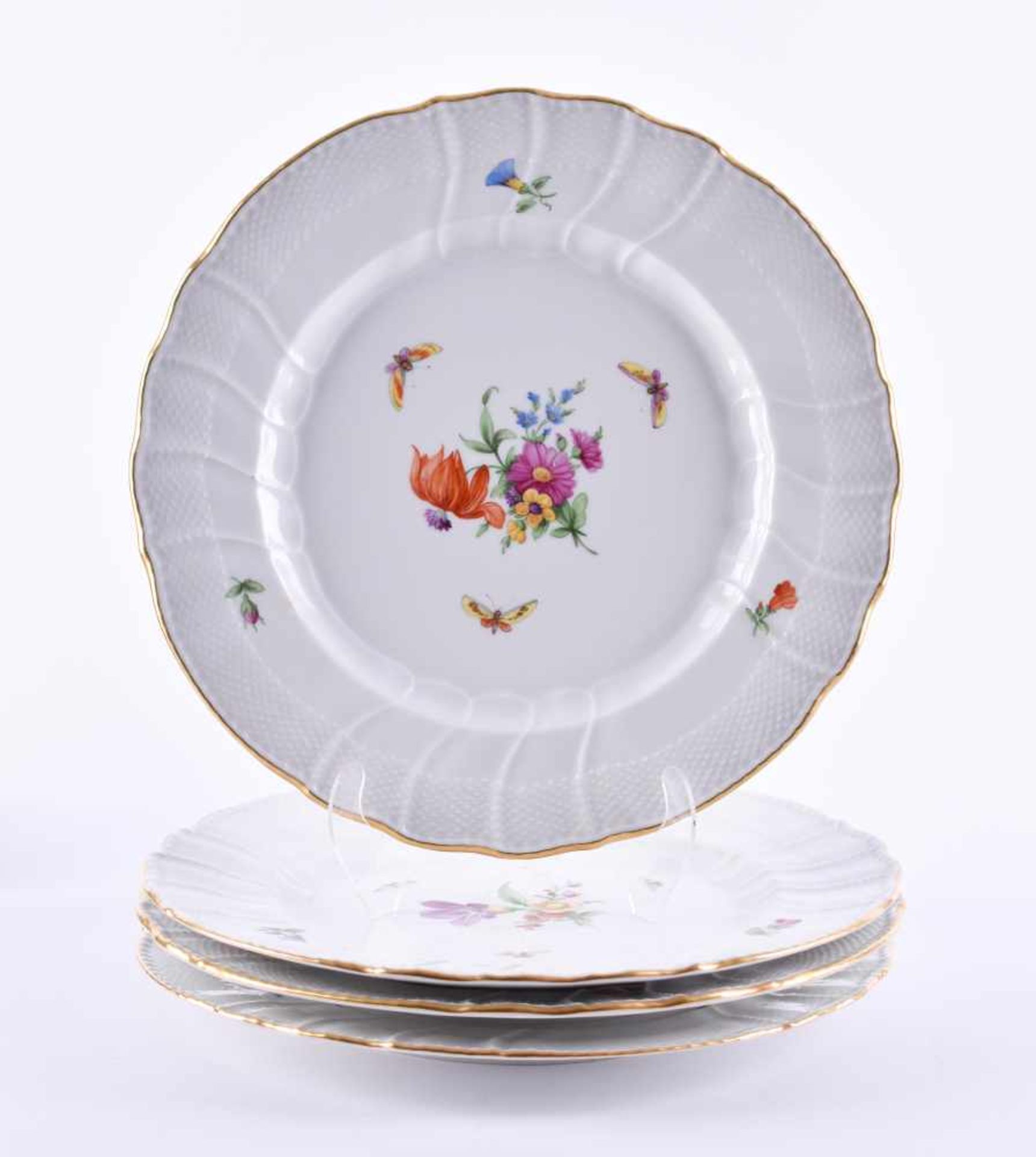 4 plates KPM Berlin 1962-1992colored and gold decorated with floral and butterfly decoration, blue