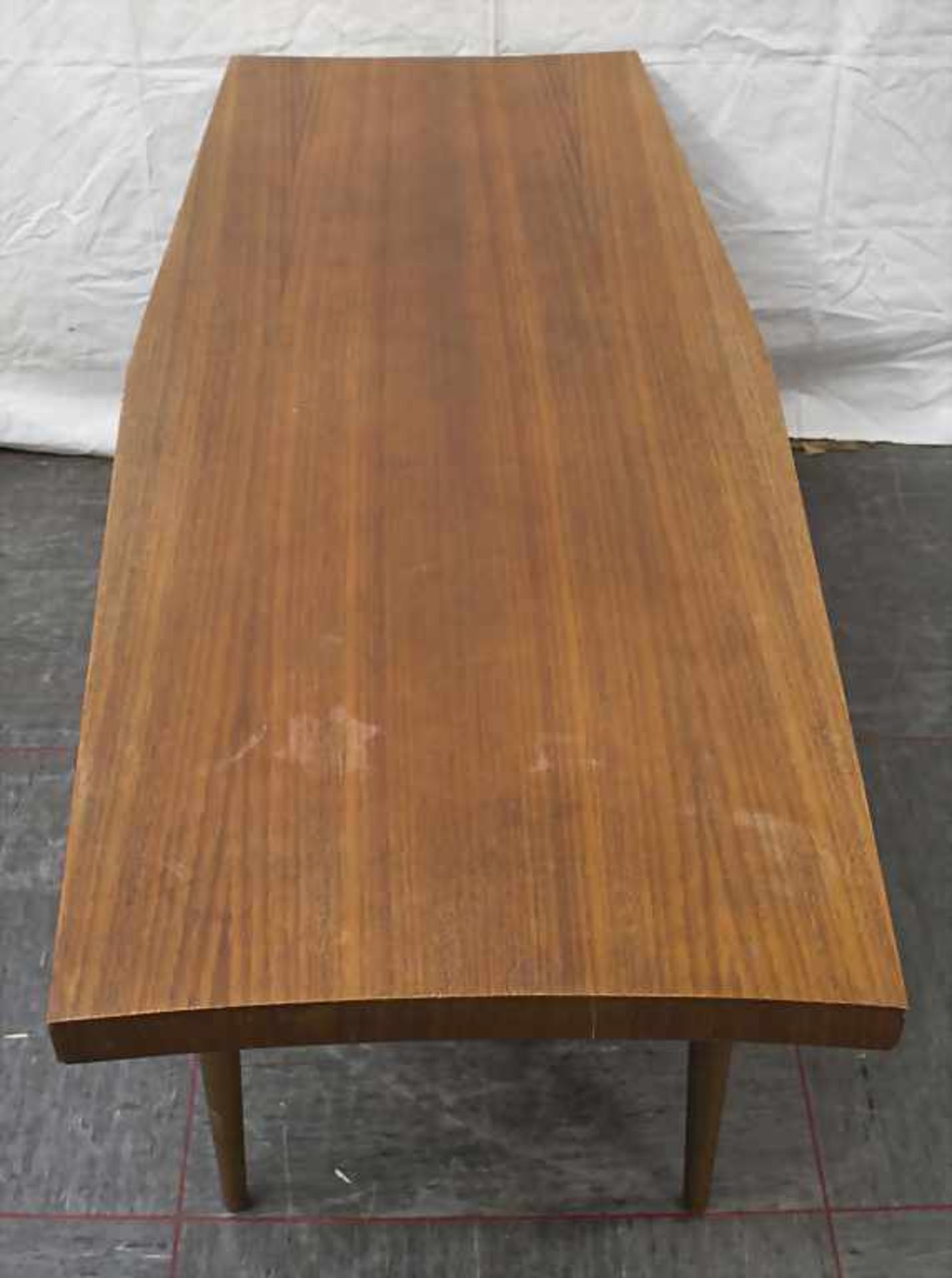 Couchtisch / A coffee table, 1960er JahreMaterial: Holz, Maße: H. 50 cm, L. 119 cm, T. 50 cm,