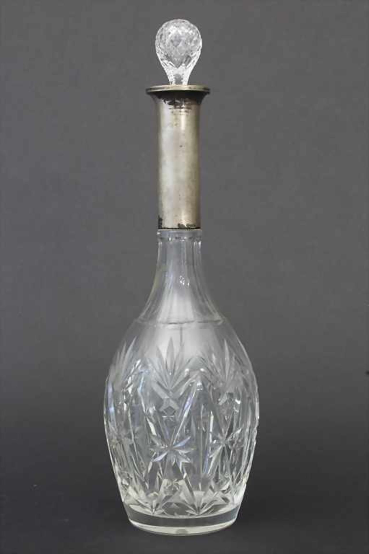 Kristallkaraffe mit Silbermontierung / A cut glass vase with silver mount, deutsch, um 1950Material: