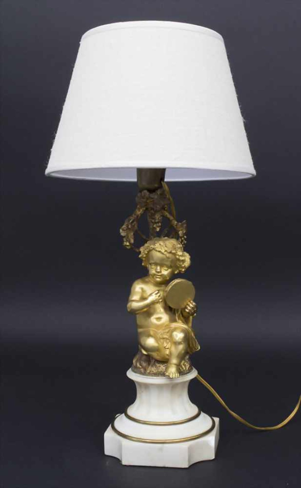 Figurenlampe 'Putto mit Tamburin' / A figural lamp 'Putto with tambourine'Technik: Bronze,