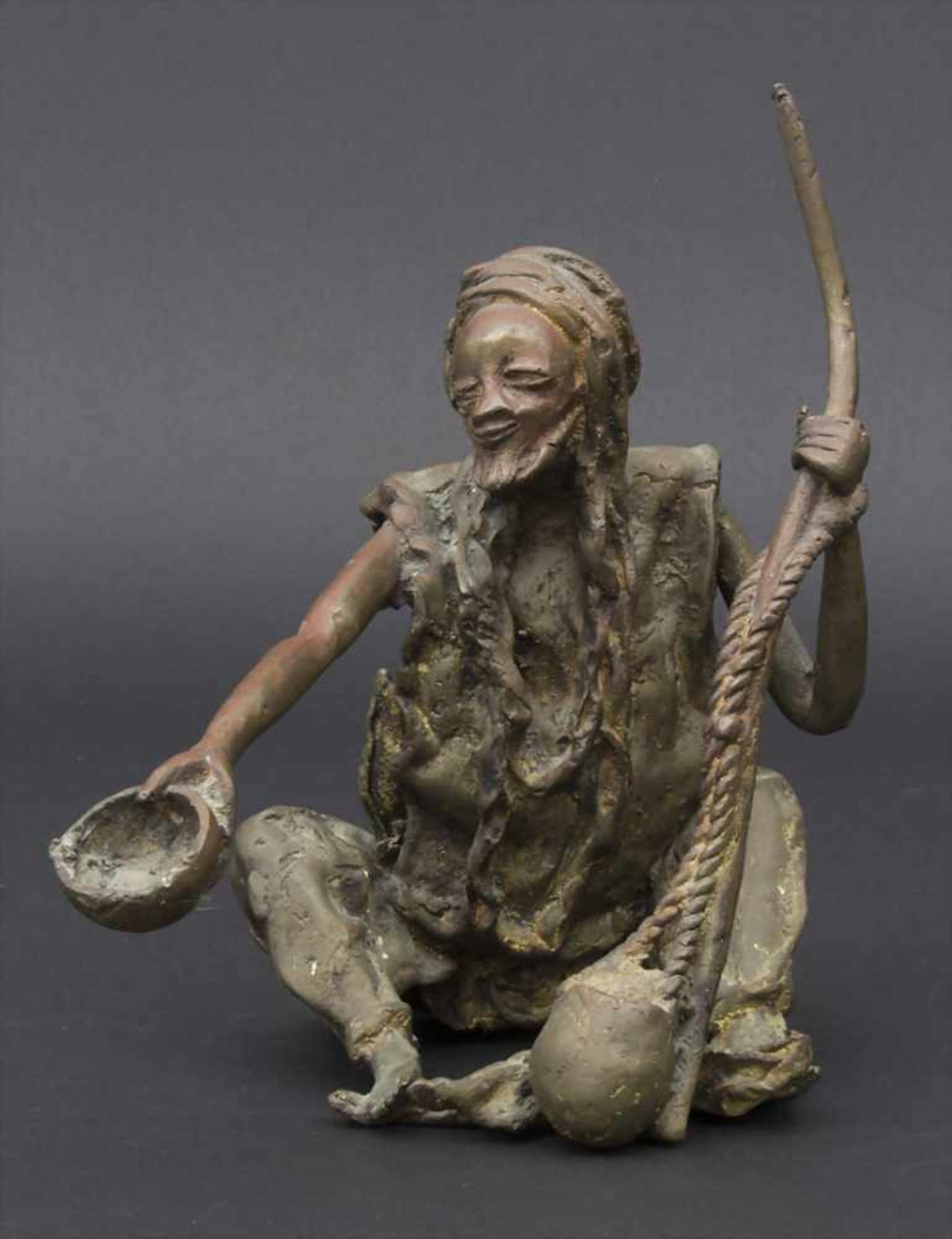 Bronzefigur 'Bettler' / A bronze figure 'Beggar', Afrika, 20. Jh.Technik: Bronze, patiniert,