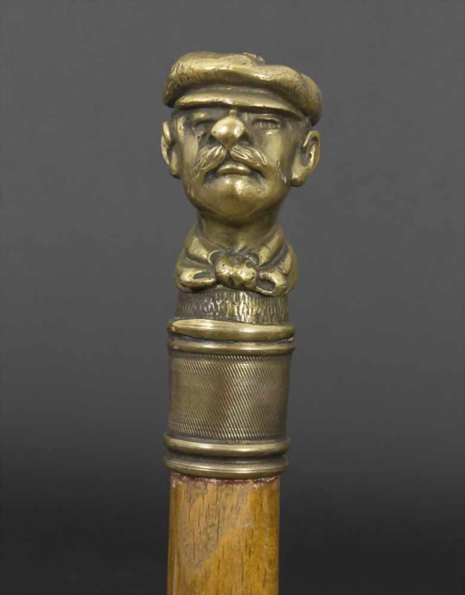 Gehstock mit Figurengriff 'Männerkopf' / A cane with figural handle 'Head of a man', um
