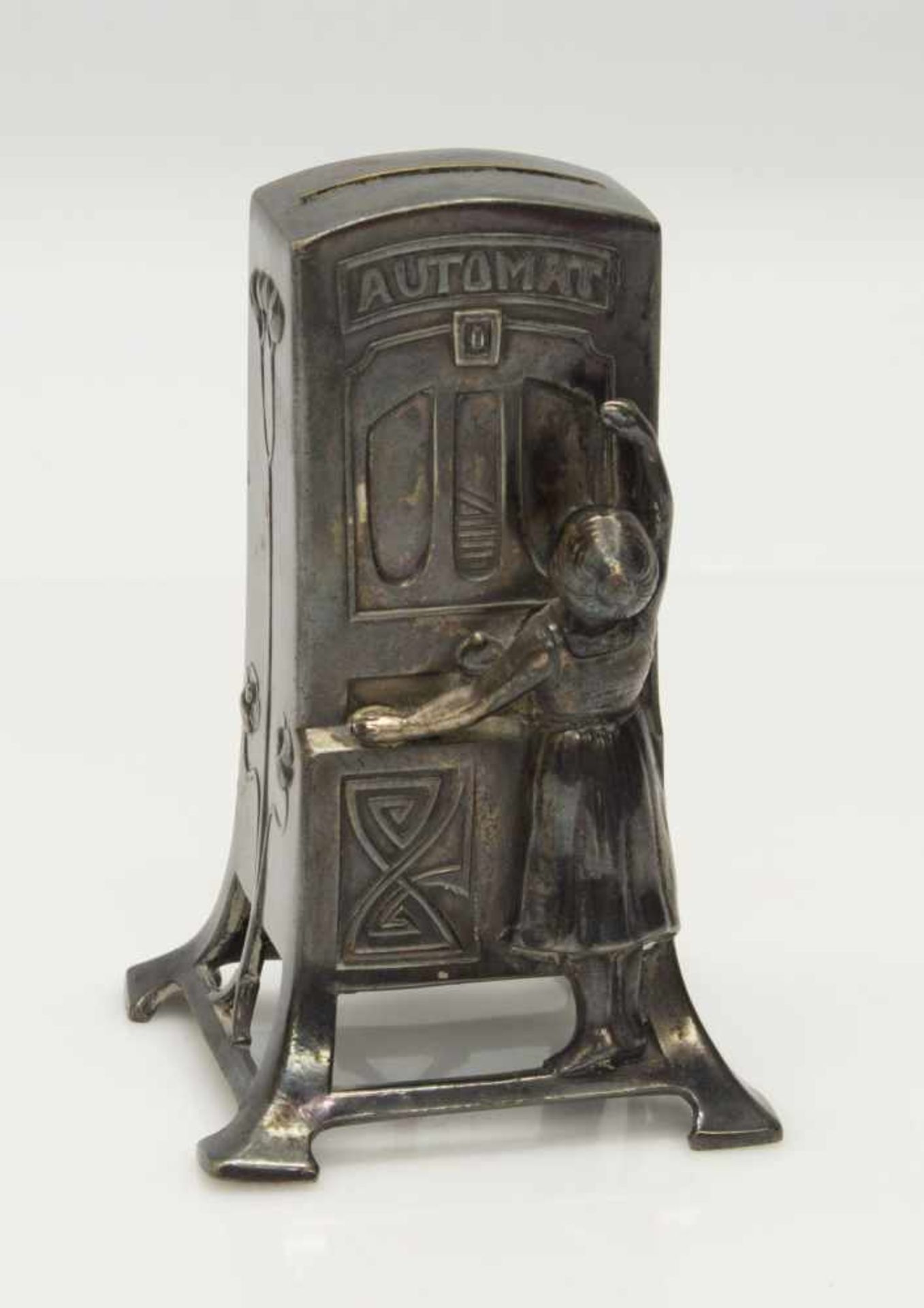 Jugendstil Spardoseum 1900, als Schokoladenautomat gestaltet, versilbert, Boden fehlt, H. 12 cm