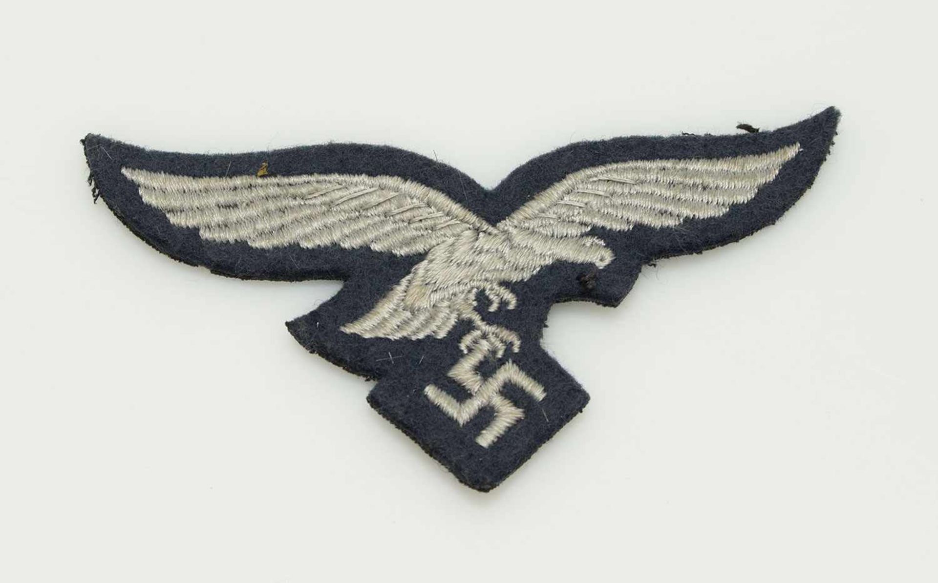 Luftwaffen-BrustadlerIII. Reich, für Mannschaften, maschinengestickte Ausführung auf graublauem