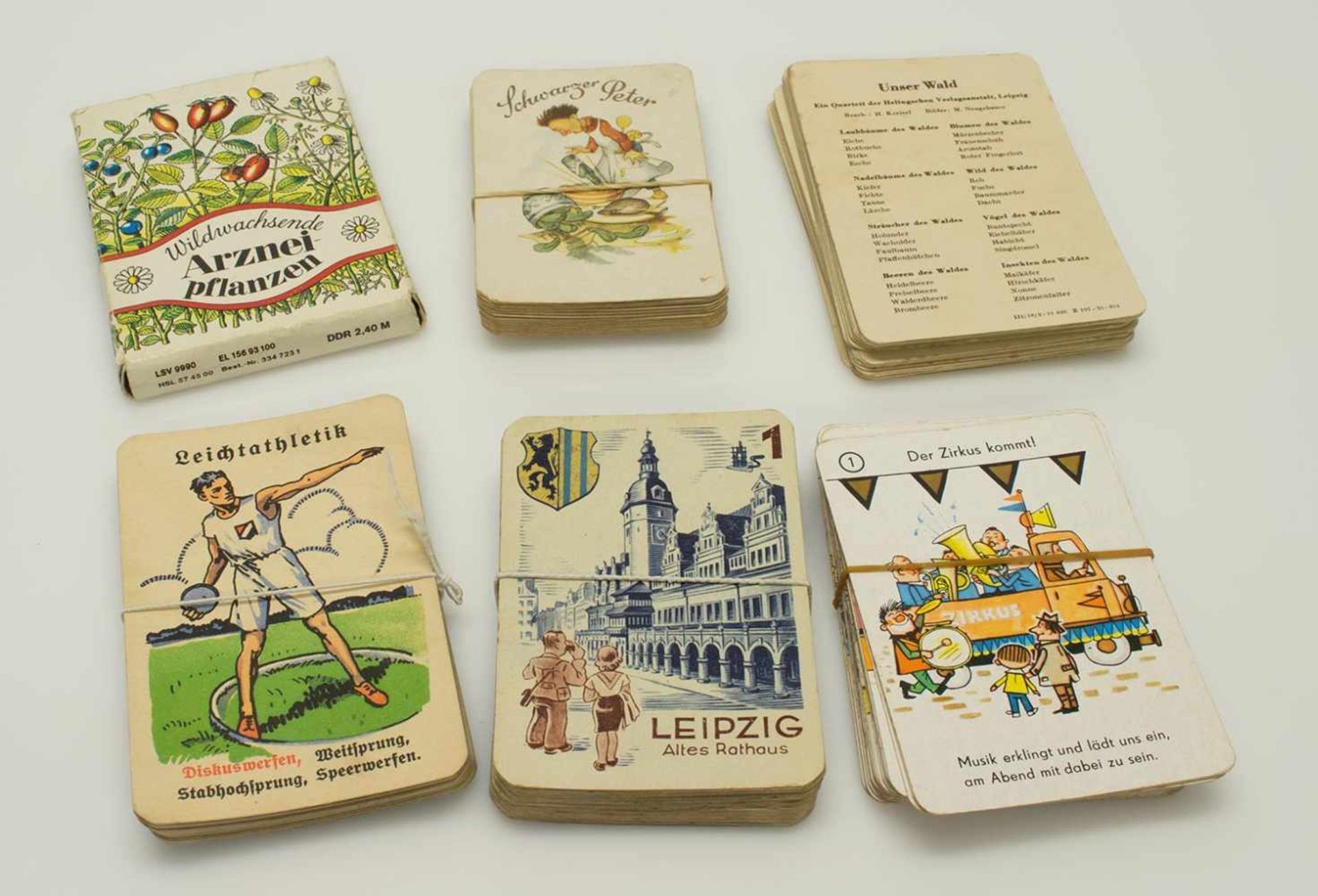 Lot SpielkartenStädtequartett von RAL um 1930/ Unser Wald um 1950/ Sport um 1920/ Zirkus um 1970/