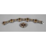 Parure mit Granaten2. Hälfte 20. Jh., Silber geprüft, bestehend aus 19 cm langem Armband und