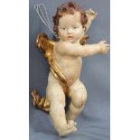 Putto. Begleitengel. Holz geschnitzt, farbig gefasst. Älter.42 cm hoch.Cherub. Carved wood,