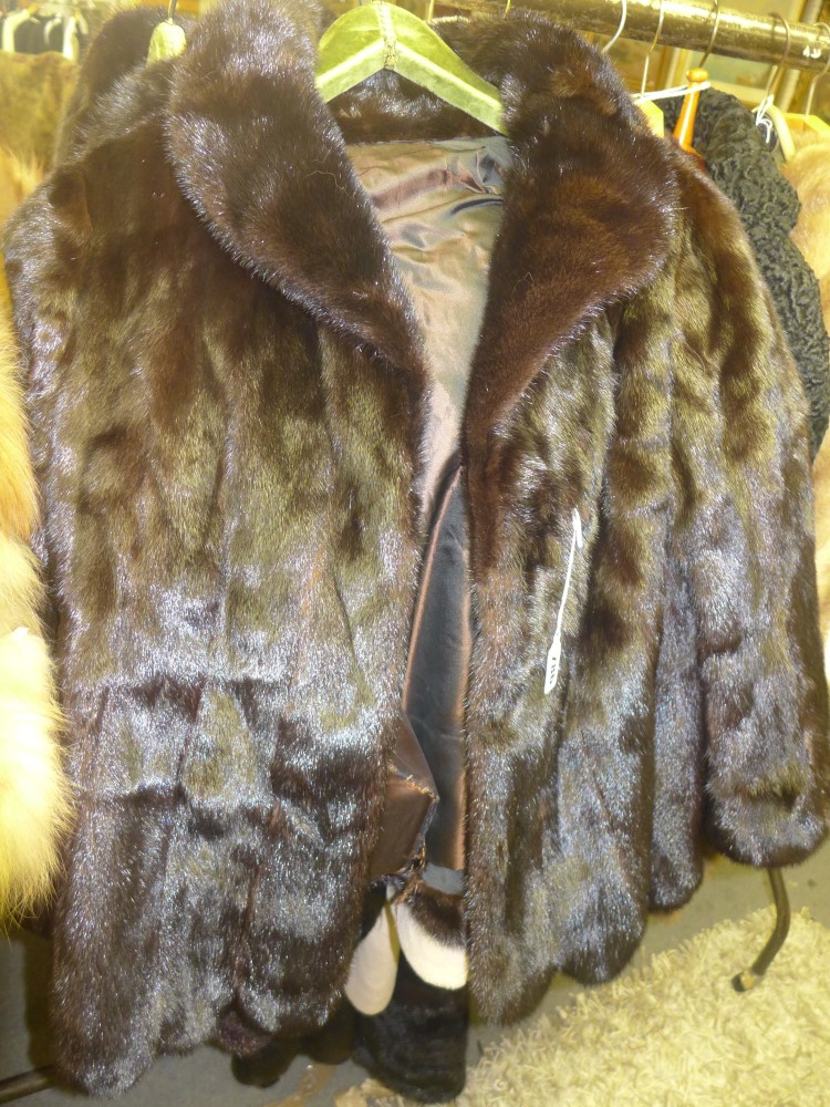 A lady's dark brown mink fur jacket with scalloped hem and turn-back collar [upstairs rail by silver