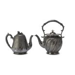 TWO TEAPOTS IN SILVER-PLATED PEWTER, PUNCH SHEFFIELD 1886/1904 embossed with floral motifs and coats