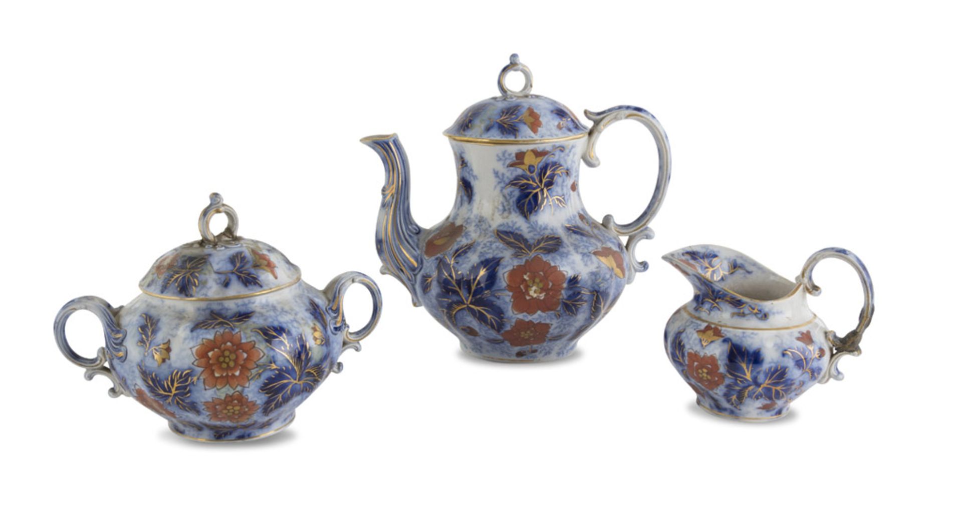 TEA SERVICE IN EARTHENWARE, ENGLAND LATE 19TH CENTURY in white, cobalt and orange enamel,