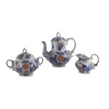 TEA SERVICE IN EARTHENWARE, ENGLAND LATE 19TH CENTURY in white, cobalt and orange enamel,