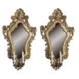 A PAIR OF GILTWOOD MIRRORS, VENETIAN 18TH CENTURY with engraved laurel frame and friezes sculpted