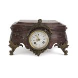 TABLE CLOCK IN RED MARBLE, LATE 19TH CENTURY white enamel dial and finishes in bronze. Measures