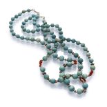 NECKLACE in hard stones, alternated by small spheres in silver-plated metal and red beads. Length
