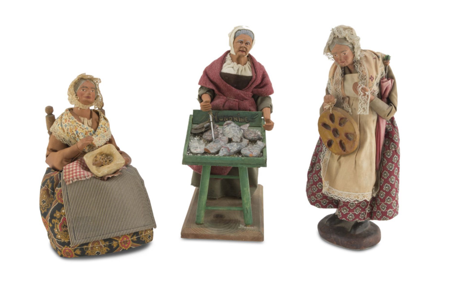 THREE CRIB FIGURES, SOUTHERN ITALY 20TH CENTURY in earthenware and wood, dressed in fabric and silk.